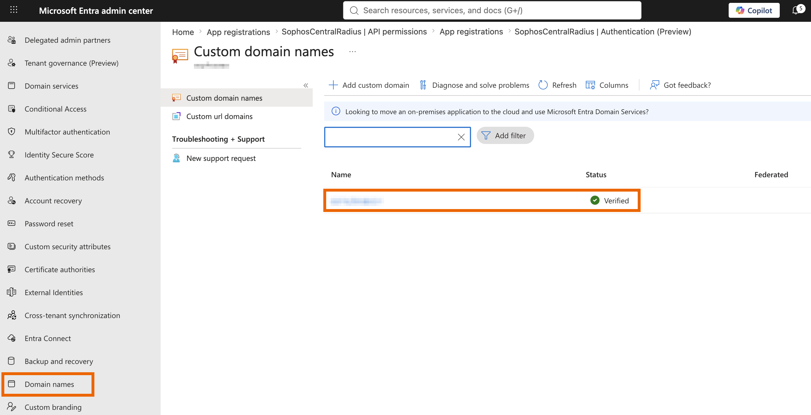 Custom domain names page in Microsoft Entra admin center showing the domain status as Verified.